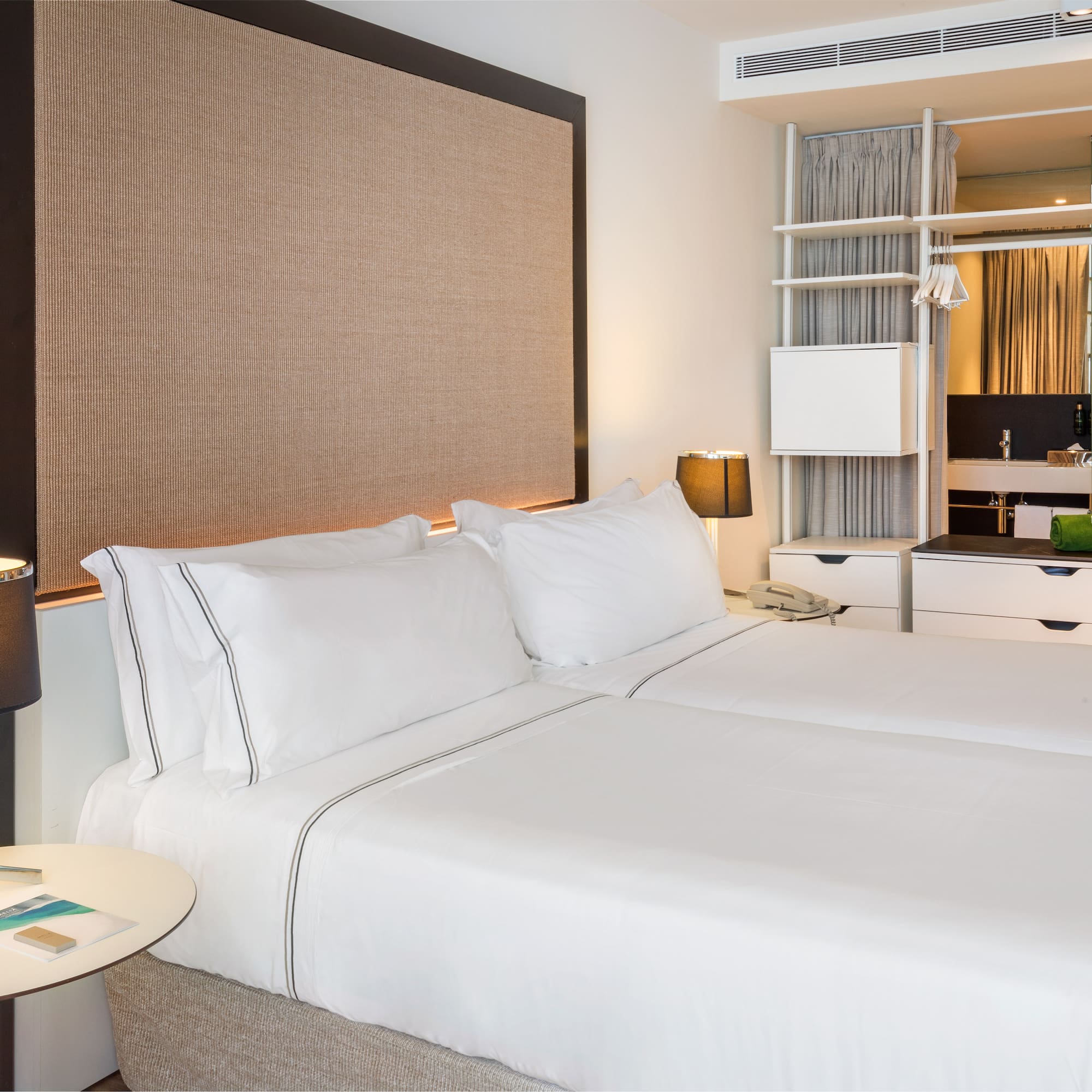 a hotel room with two beds