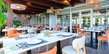 a restaurant with tables and chairs