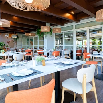 a restaurant with tables and chairs