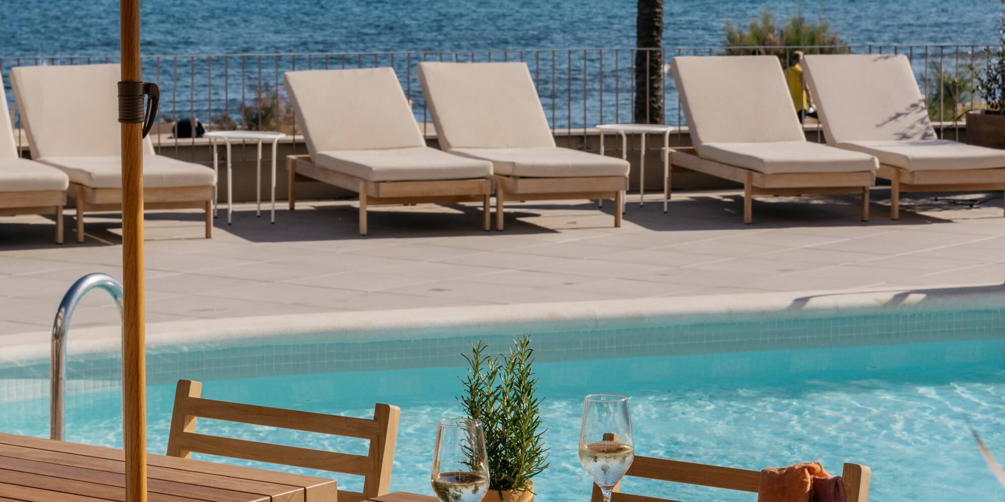 a table and chairs by a pool