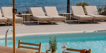 a table and chairs by a pool