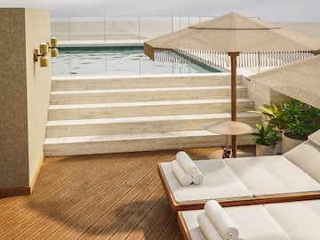 a pool with a deck chair and umbrella