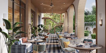 a patio with tables and chairs