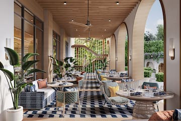 a patio with tables and chairs