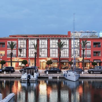 a building with boats and cars parked in front of it