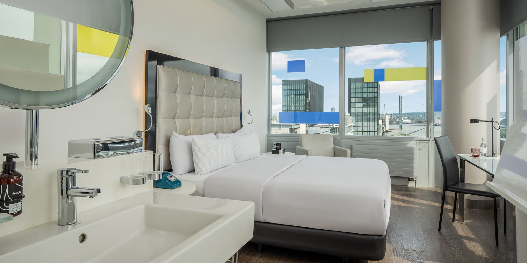 a room with a bed and sink