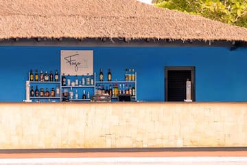 a bar with bottles of alcohol on shelves
