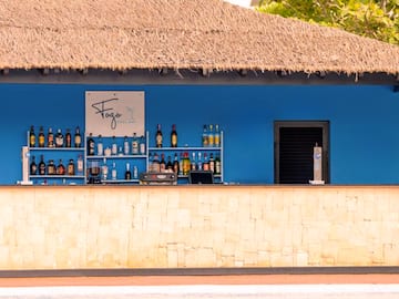 a bar with bottles of alcohol on shelves