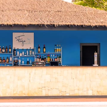 a bar with bottles of alcohol on shelves