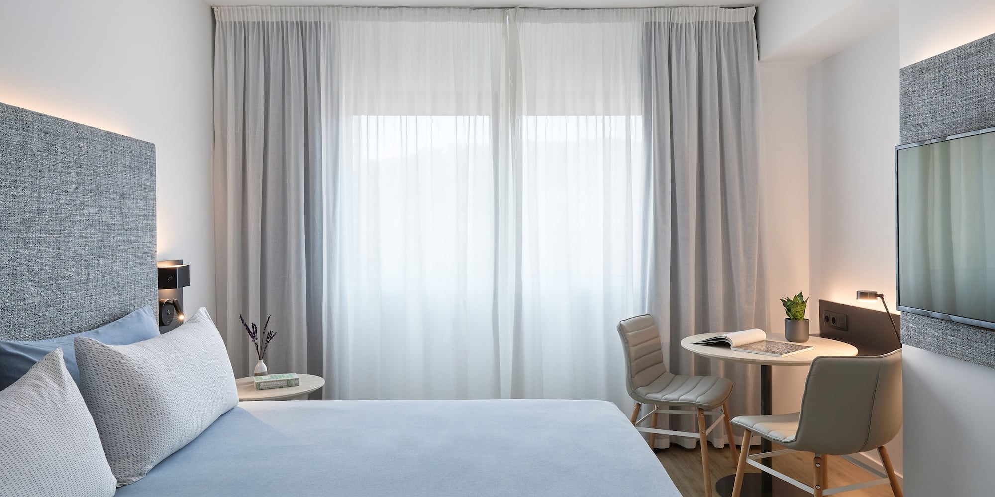 a bed and chair in a room