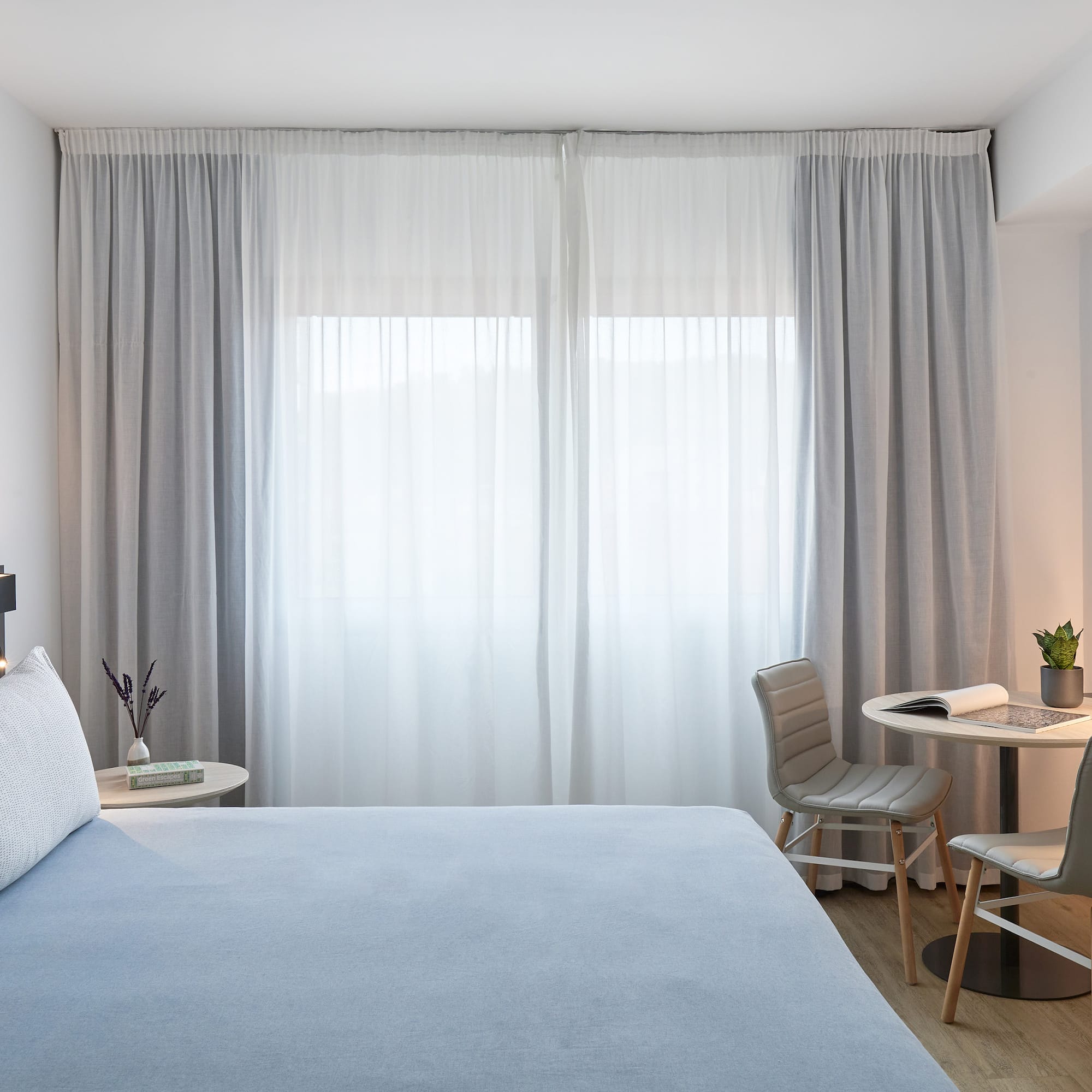 a bed and chair in a room