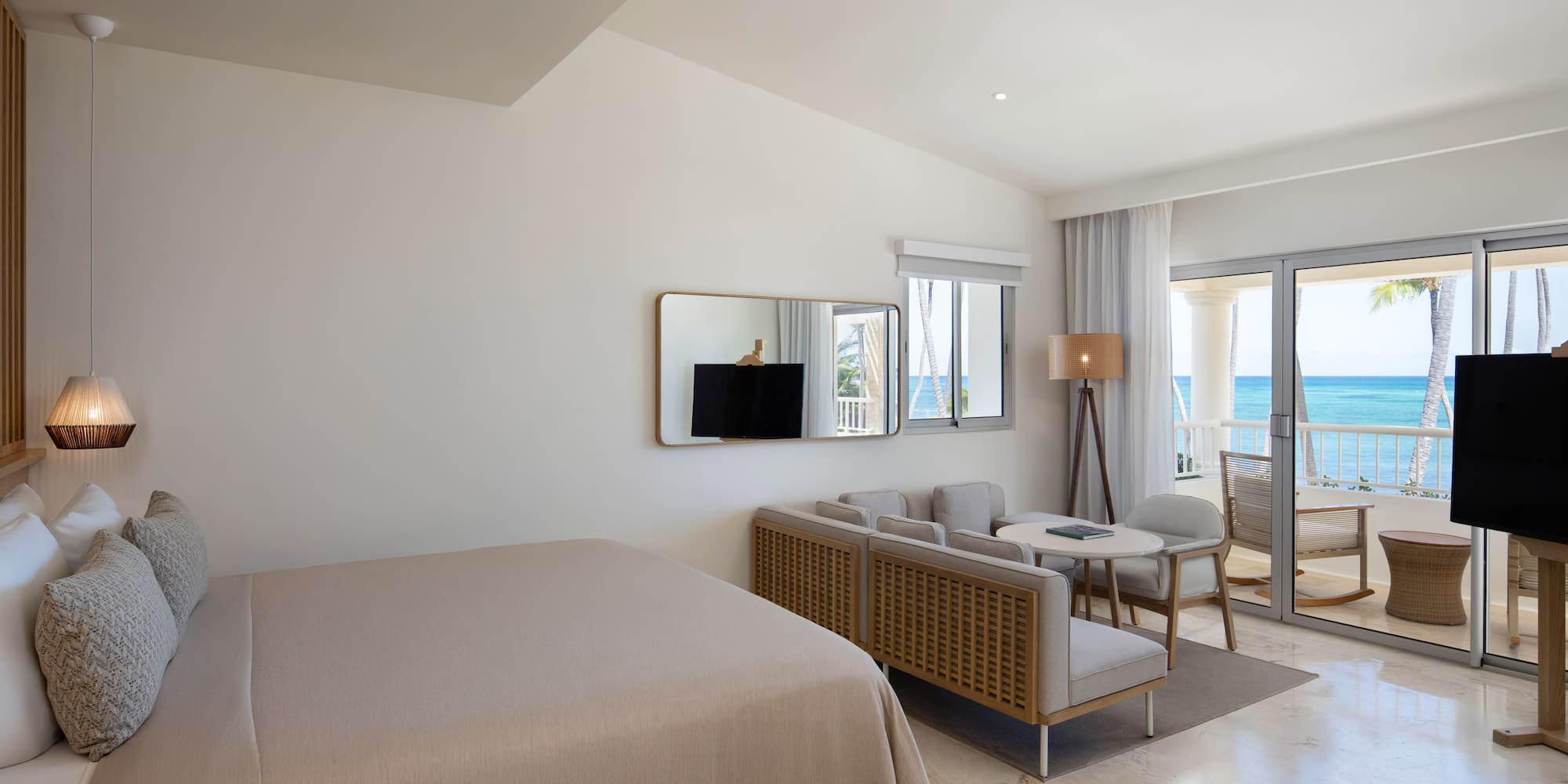 a room with a bed and a television