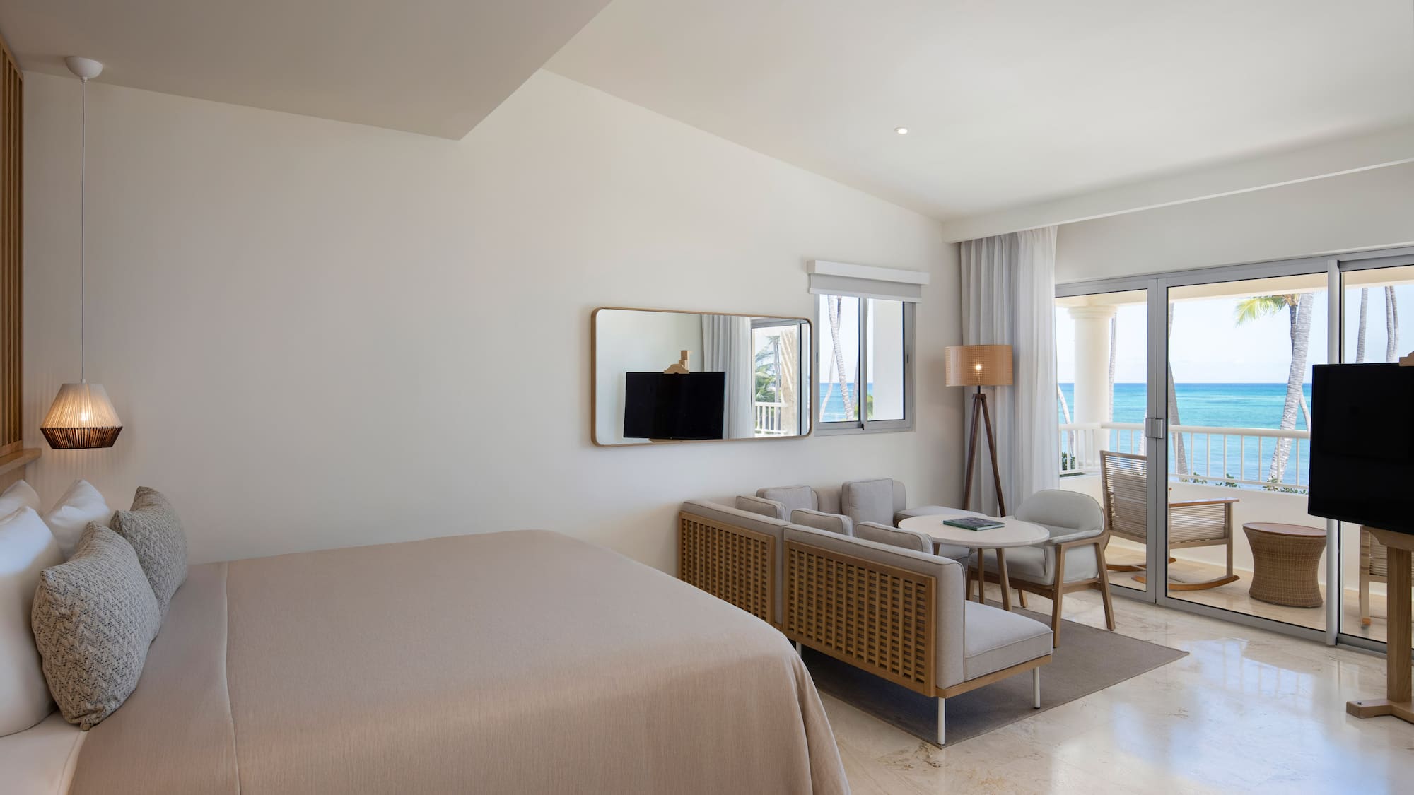 a room with a bed and a television