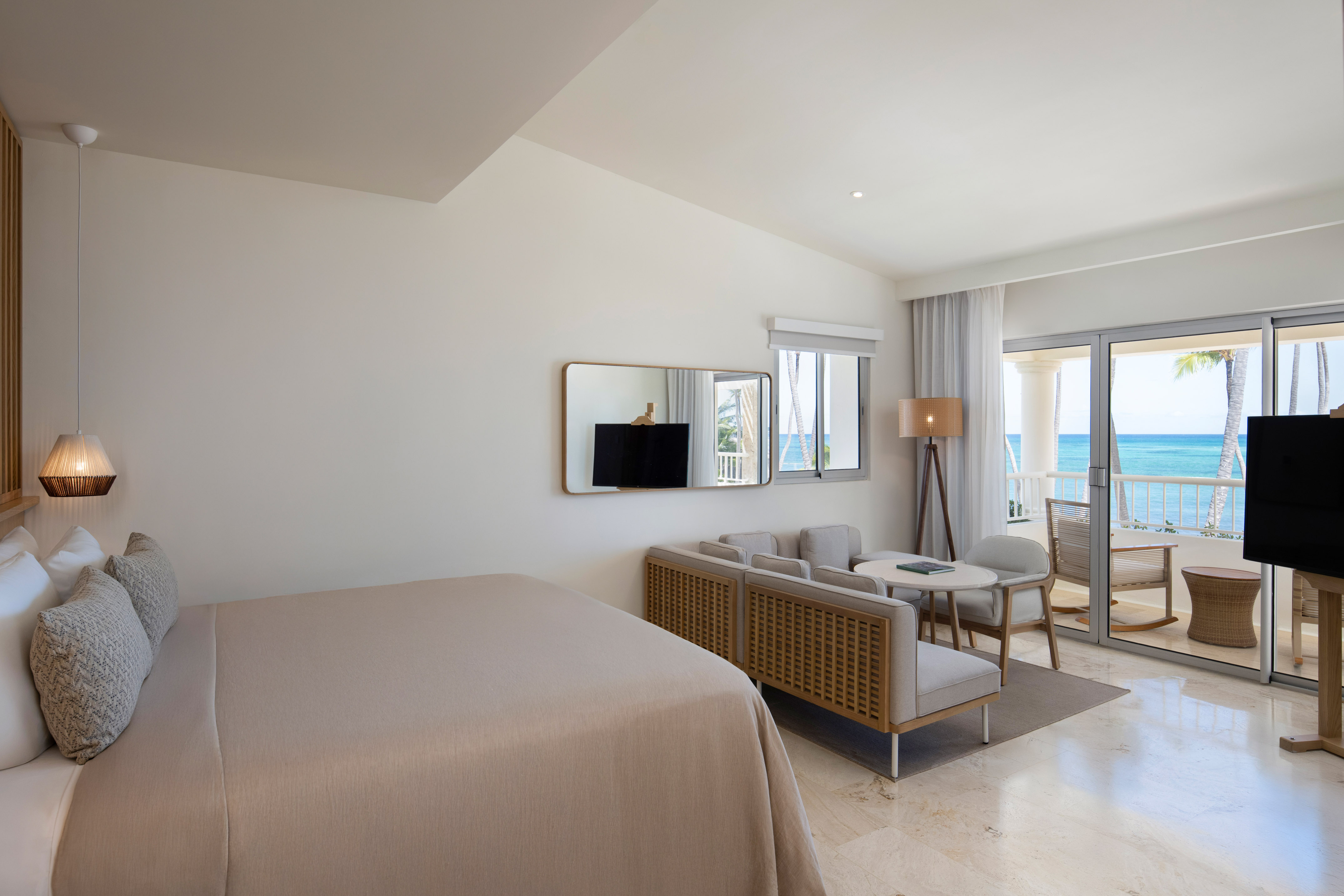 a room with a bed and a television