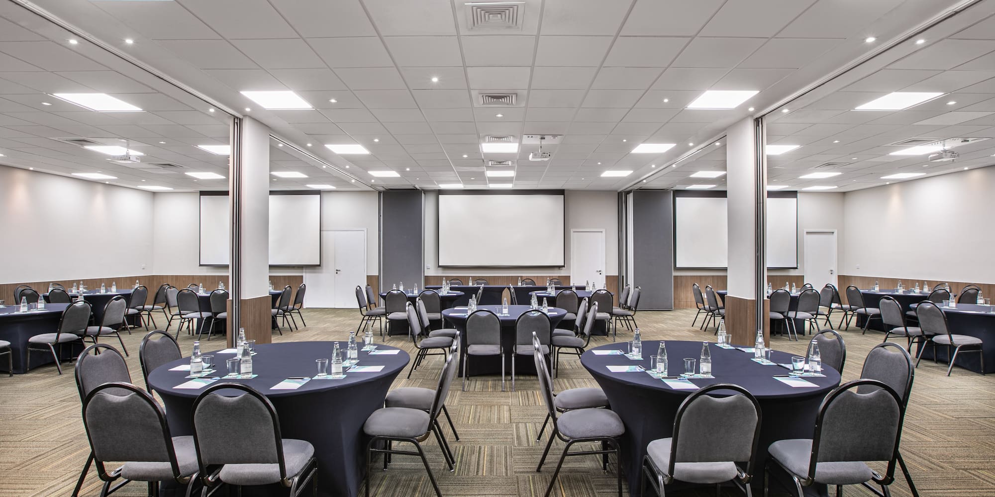 a room with round tables and chairs
