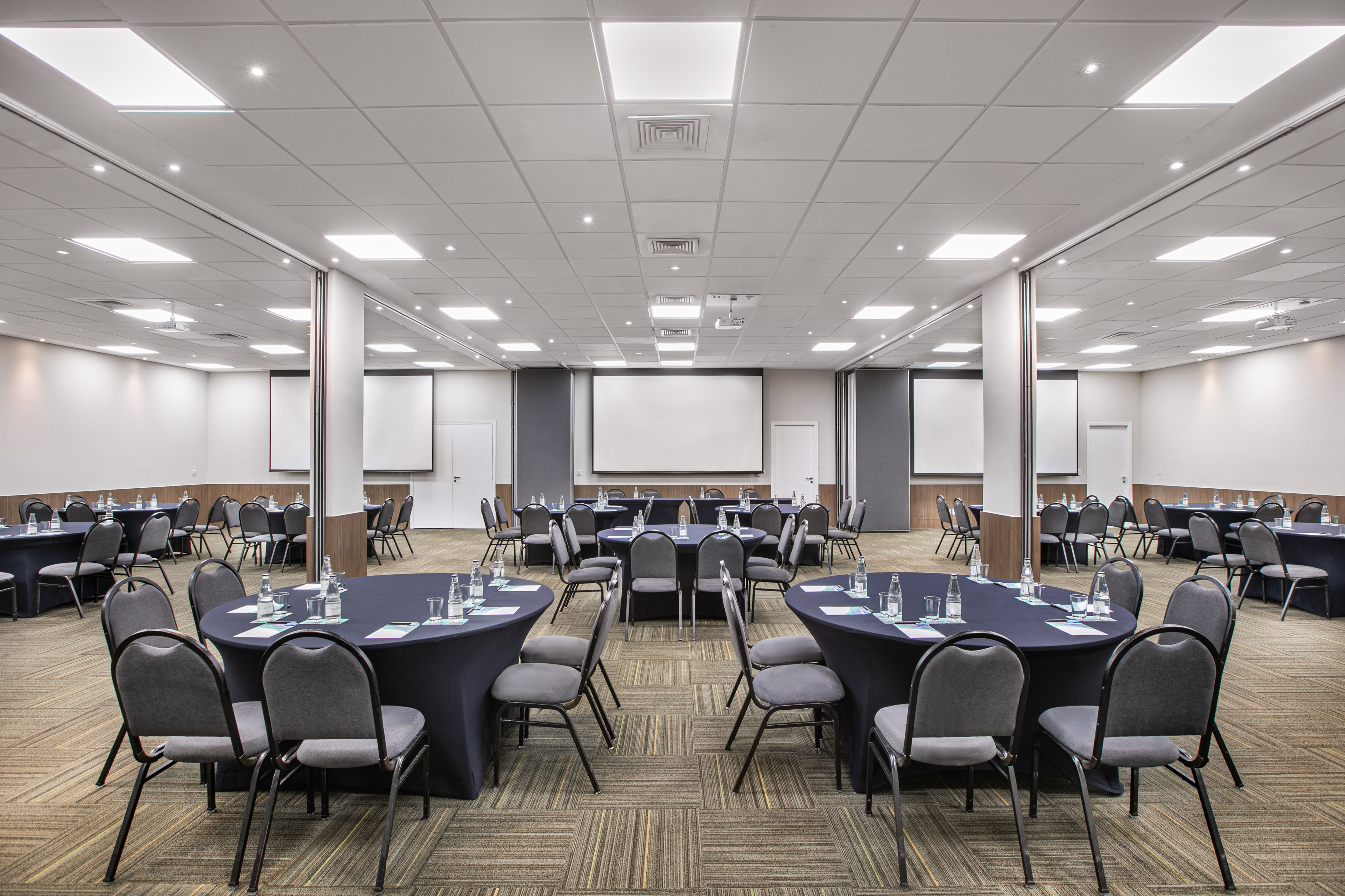 a room with round tables and chairs
