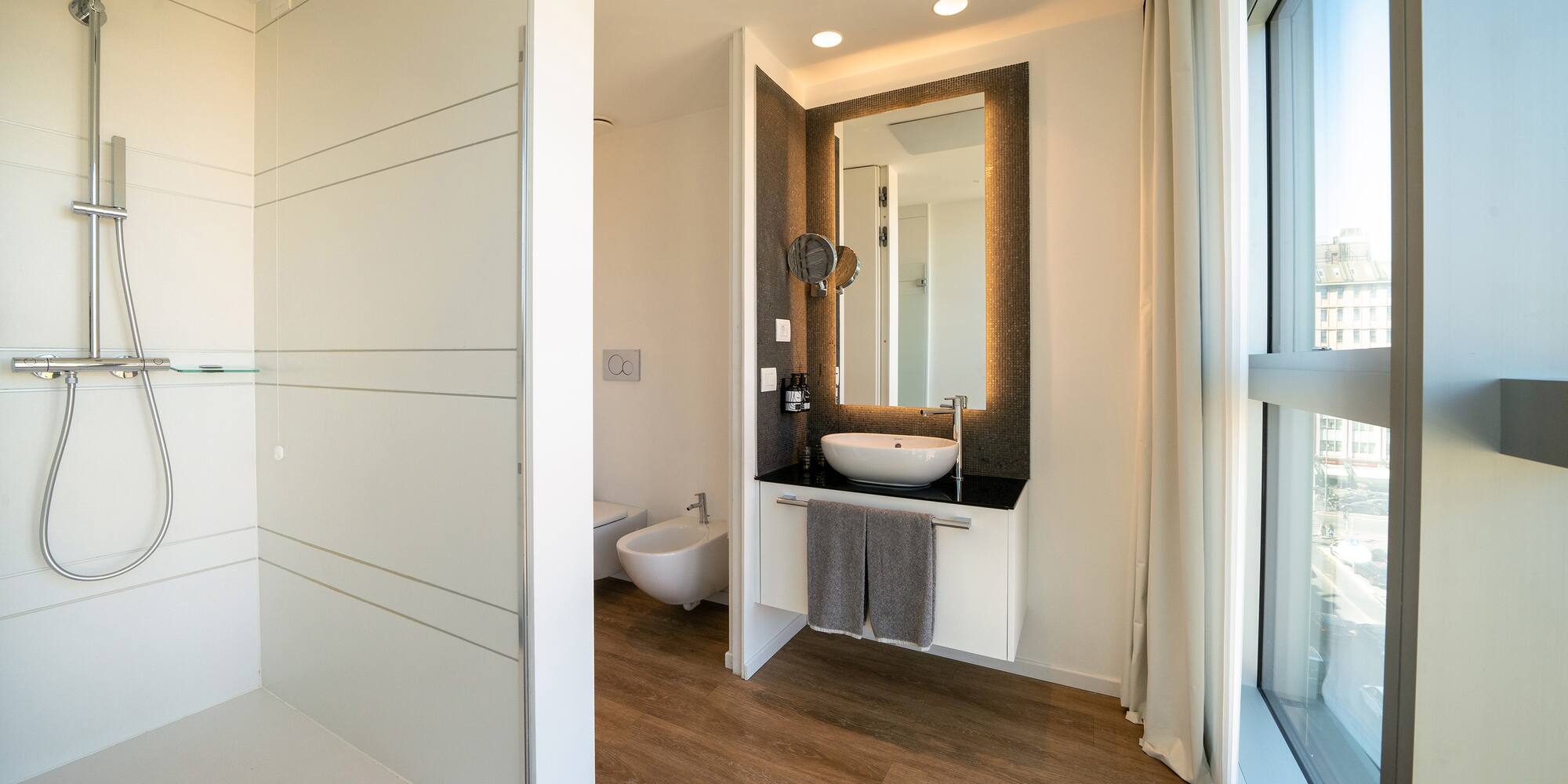 a bathroom with a mirror and a sink