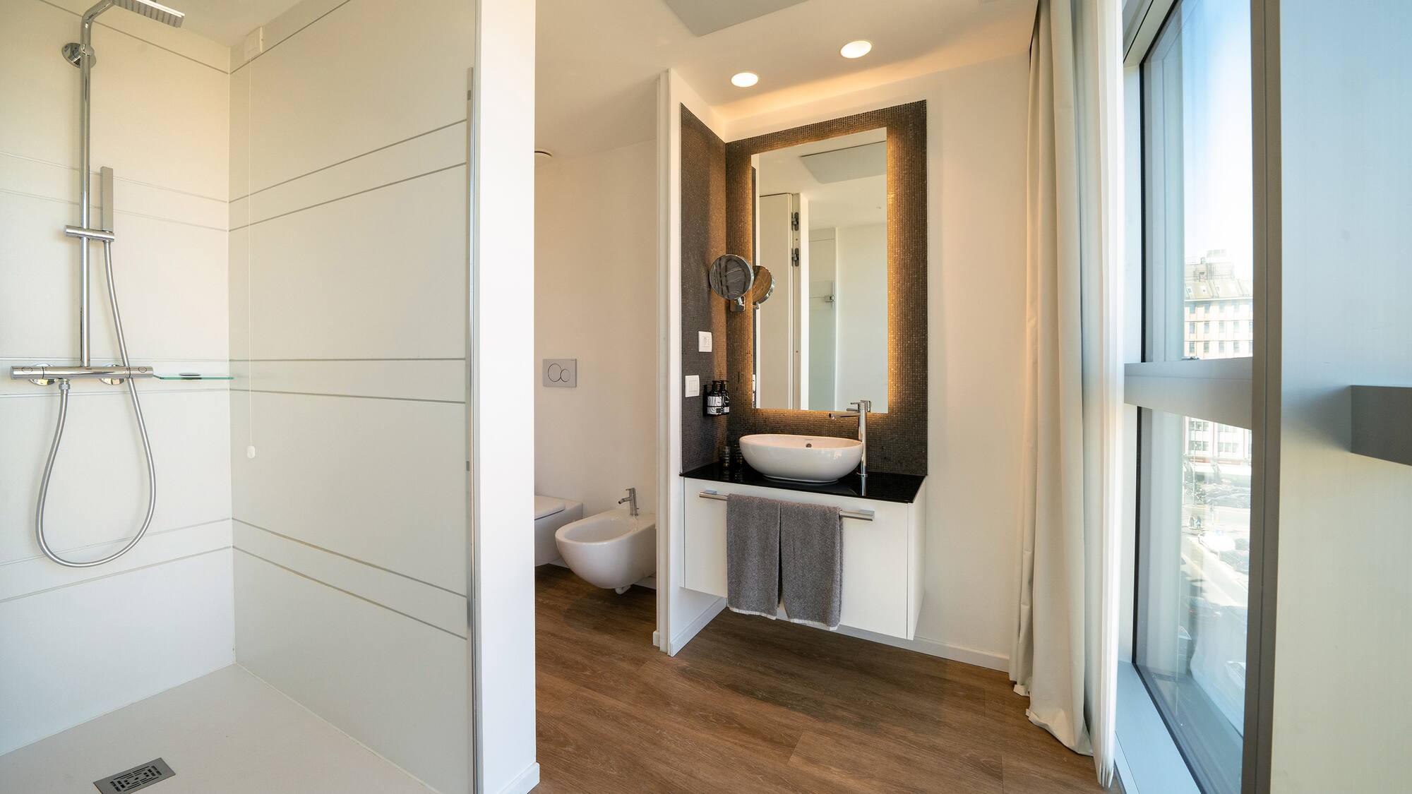 a bathroom with a mirror and a sink