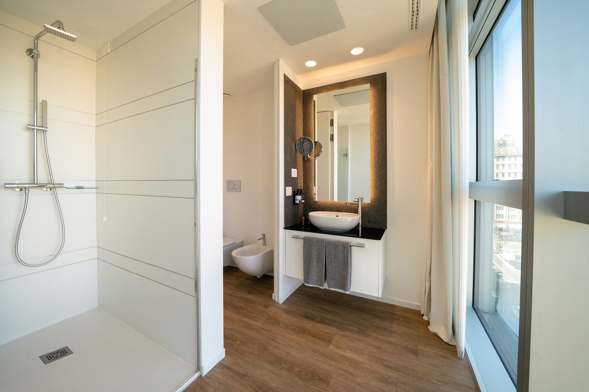 a bathroom with a mirror and a sink