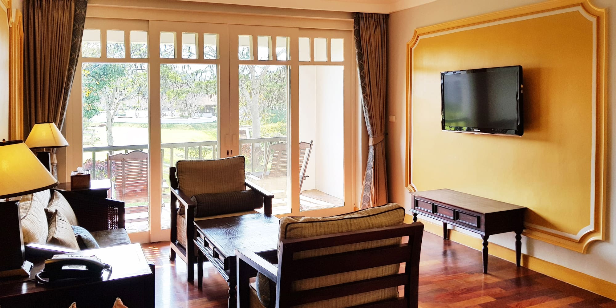 a living room with a television and a couch