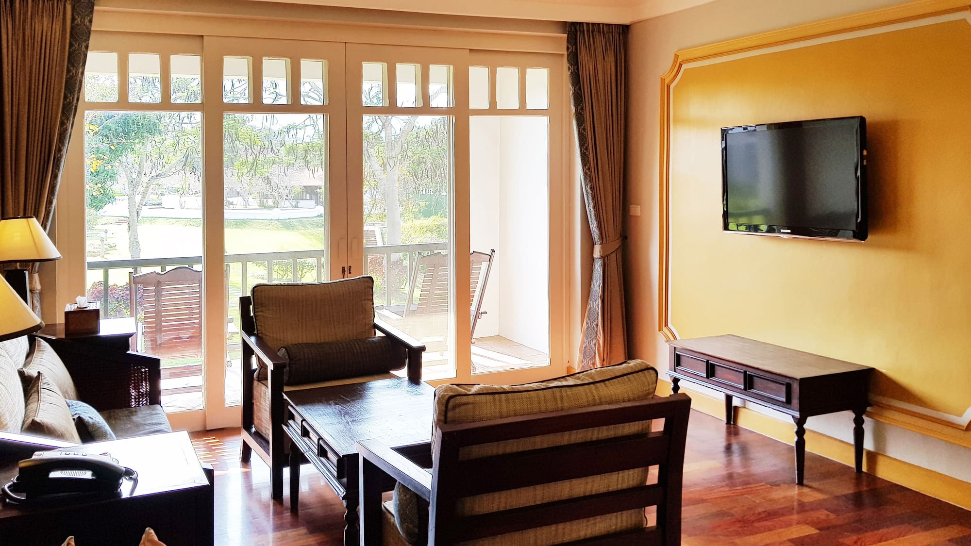 a living room with a television and a couch