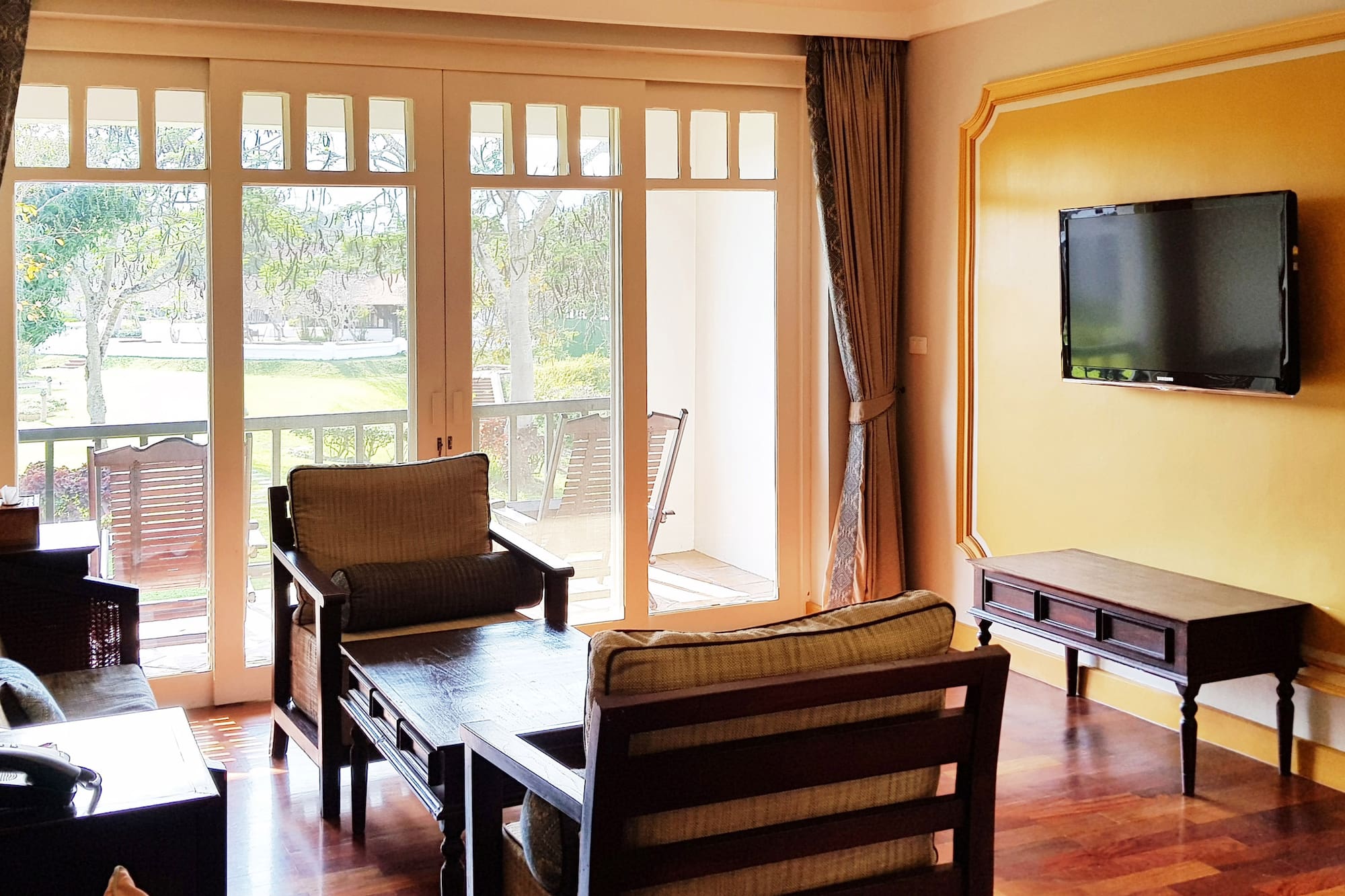 a living room with a television and a couch