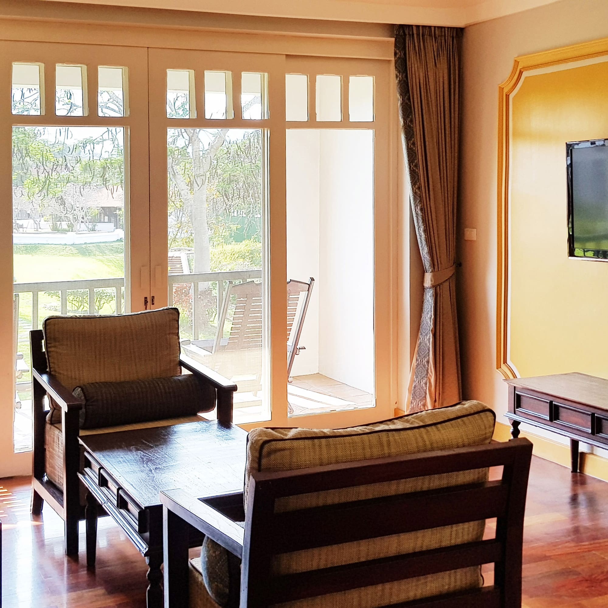 a living room with a television and a couch