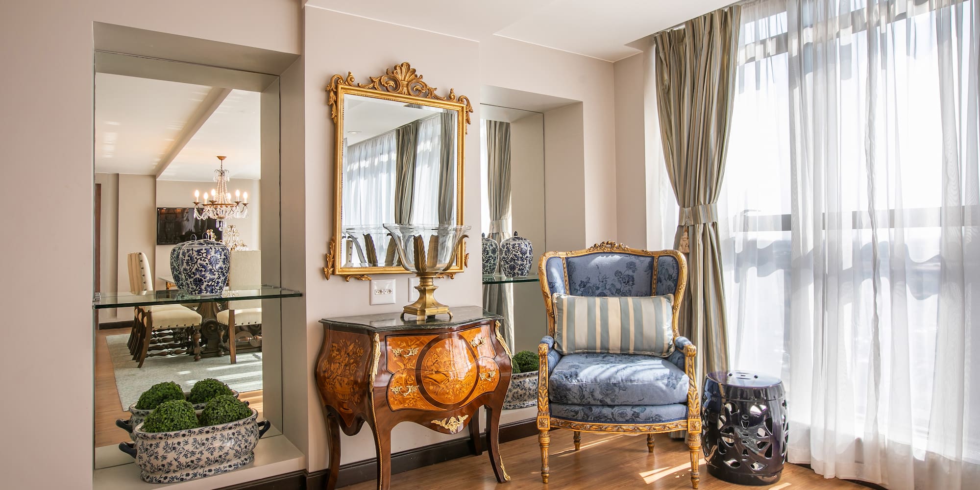 a room with a mirror and a chair