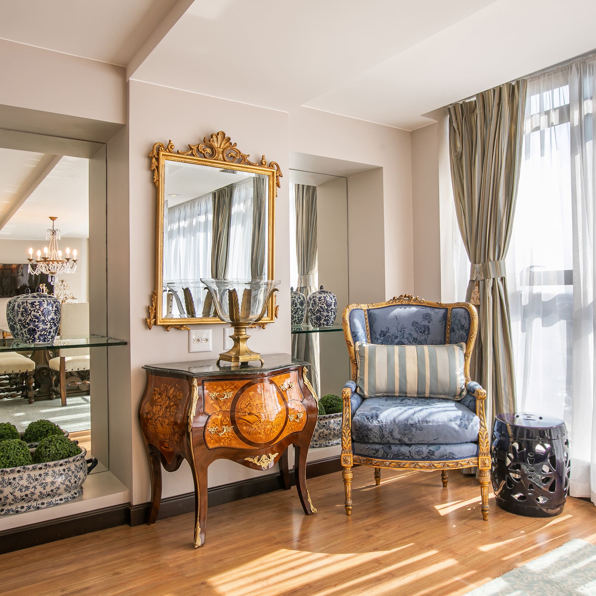 a room with a mirror and a chair