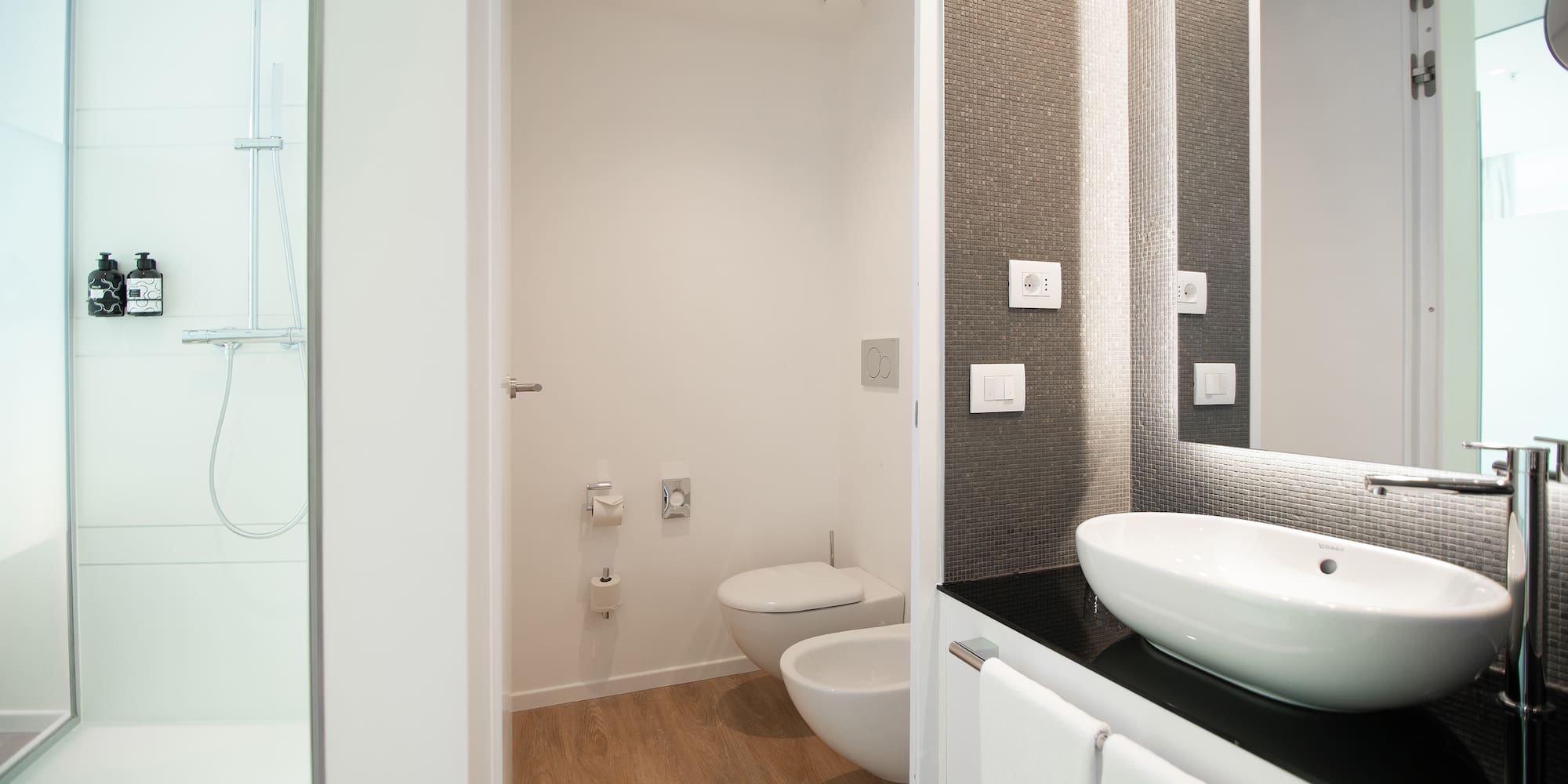 a bathroom with a sink and toilet