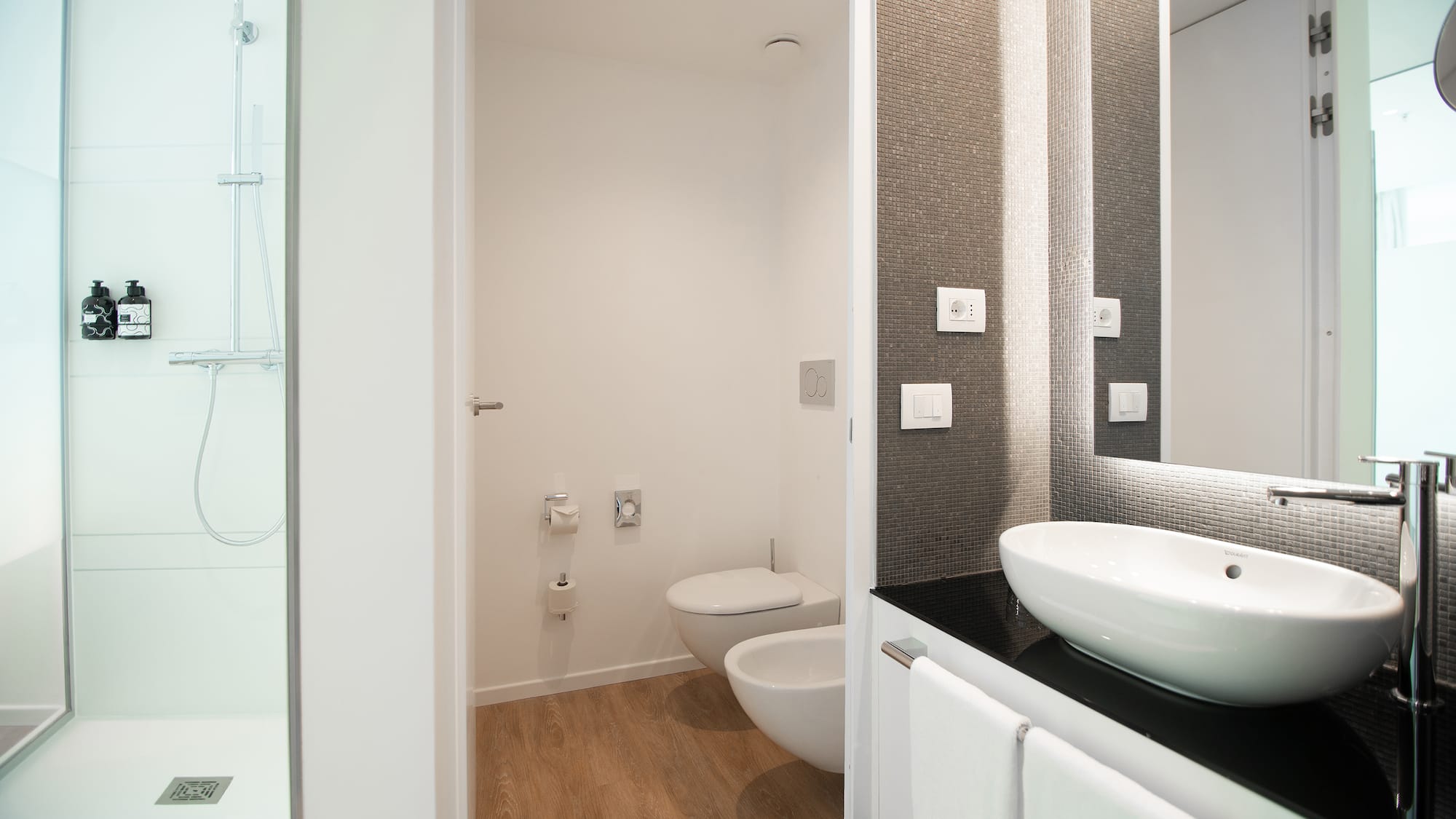 a bathroom with a sink and toilet