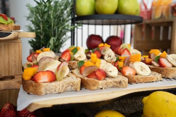 a group of fruit on toasts
