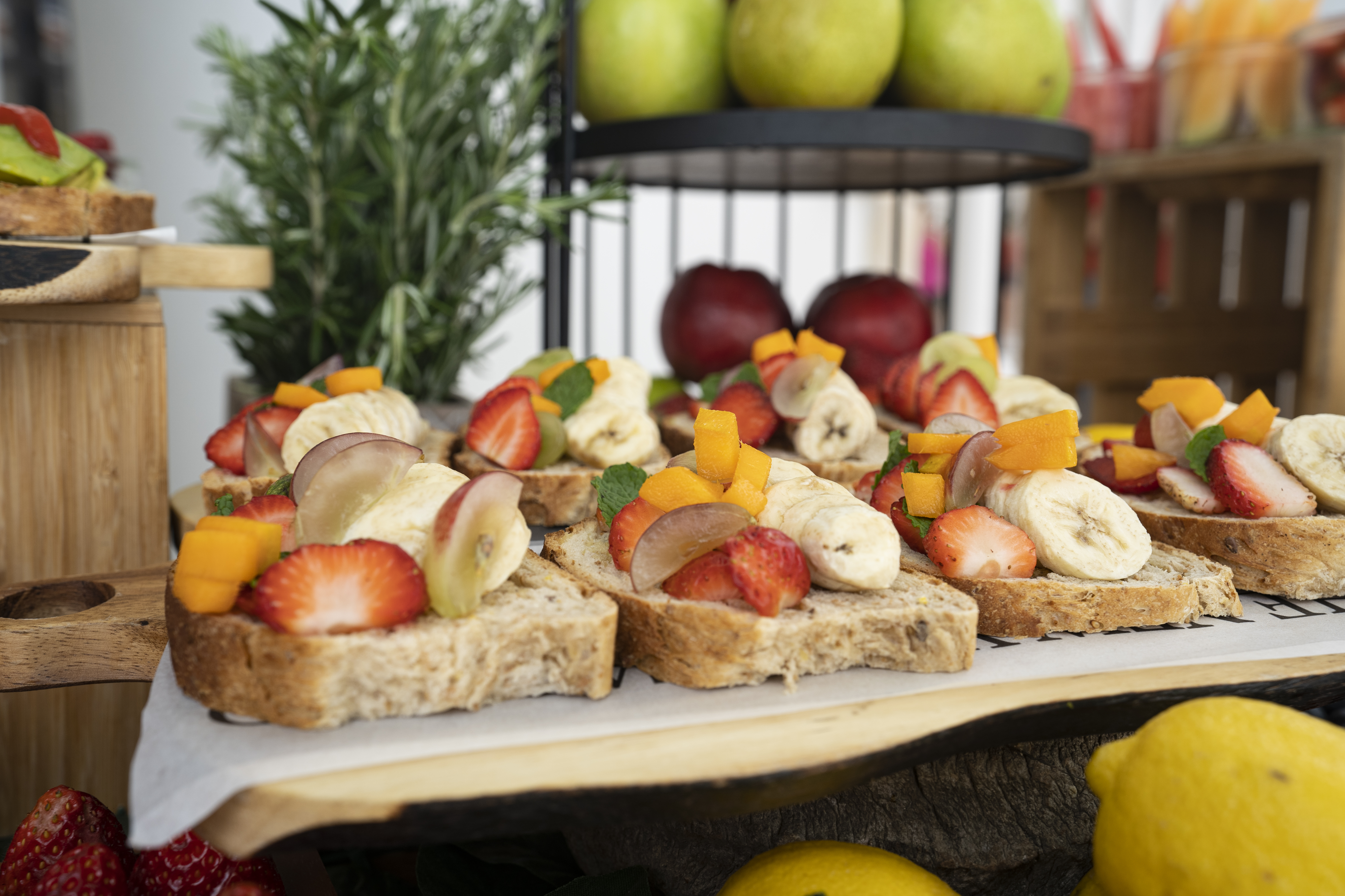 a group of fruit on toasts