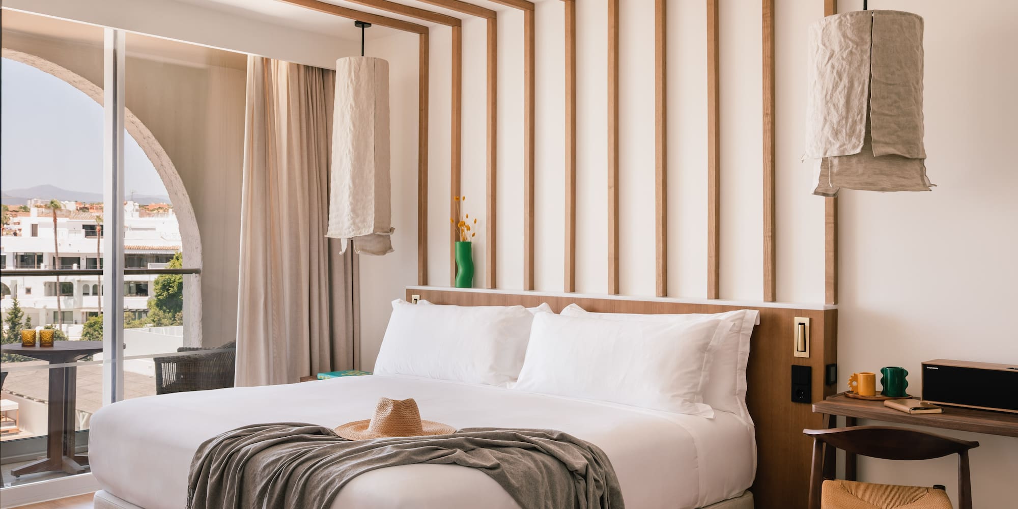 a bed with a hat on it