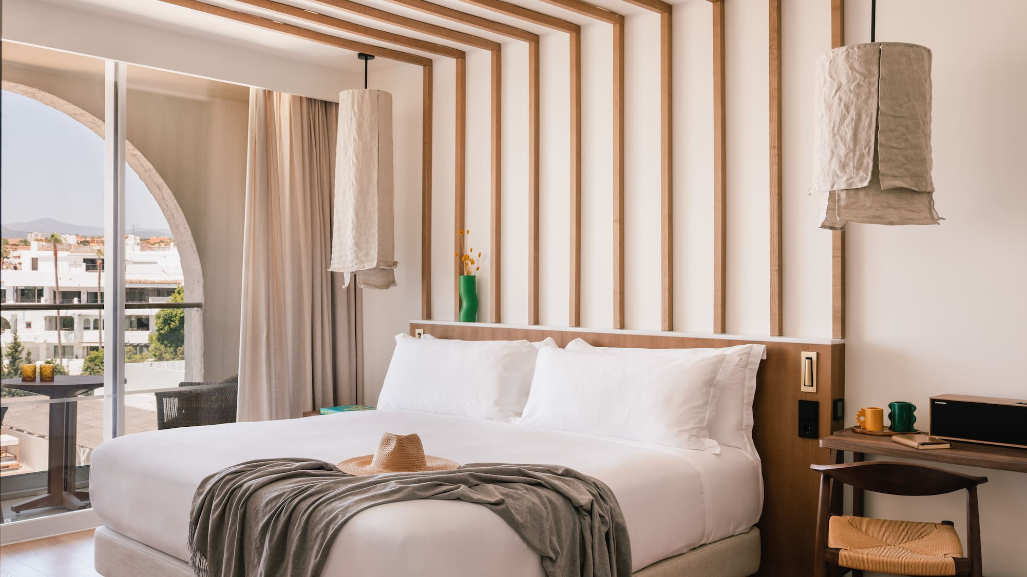 a bed with a hat on it