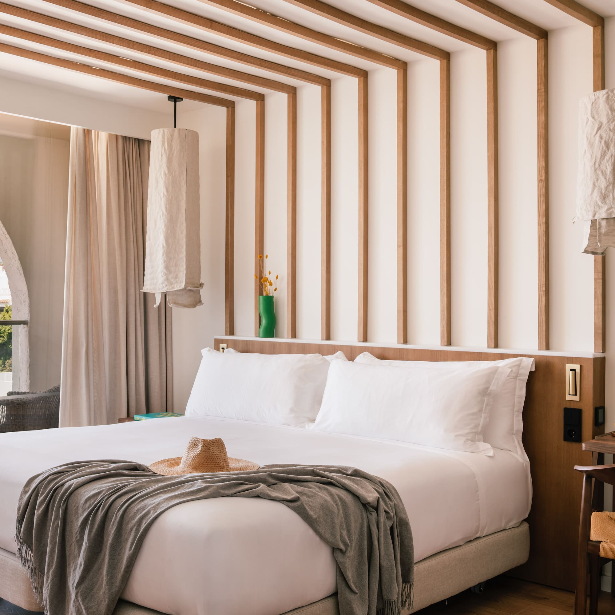 a bed with a hat on it