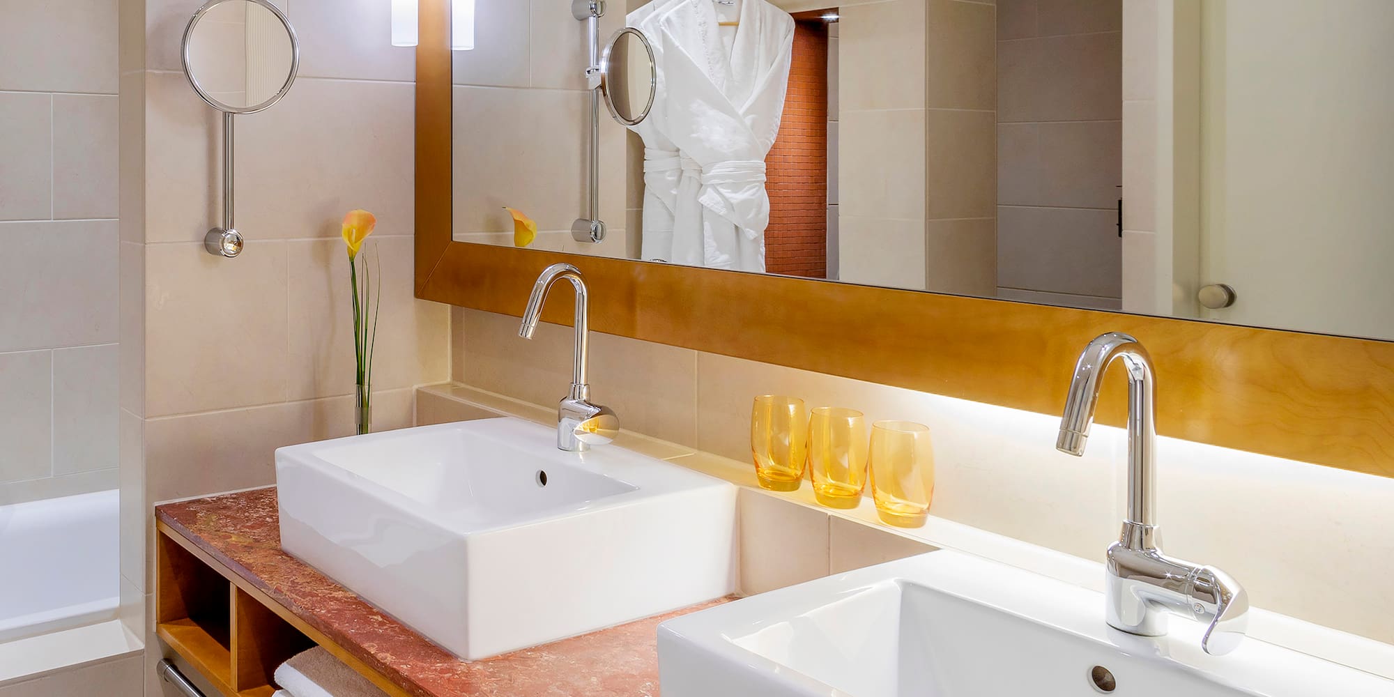 a bathroom with a mirror and sink