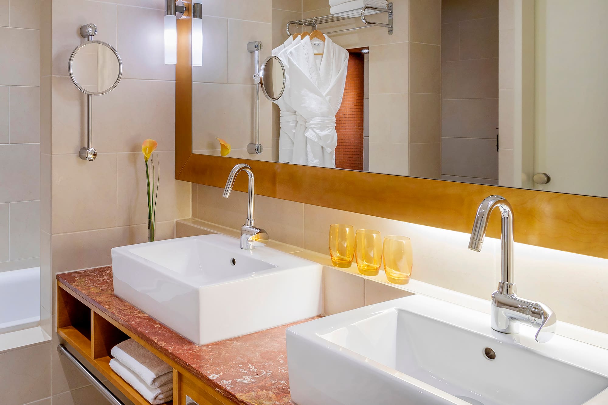 a bathroom with a mirror and sink
