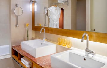 a bathroom with a mirror and sink