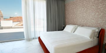 a bed in a room with a glass door