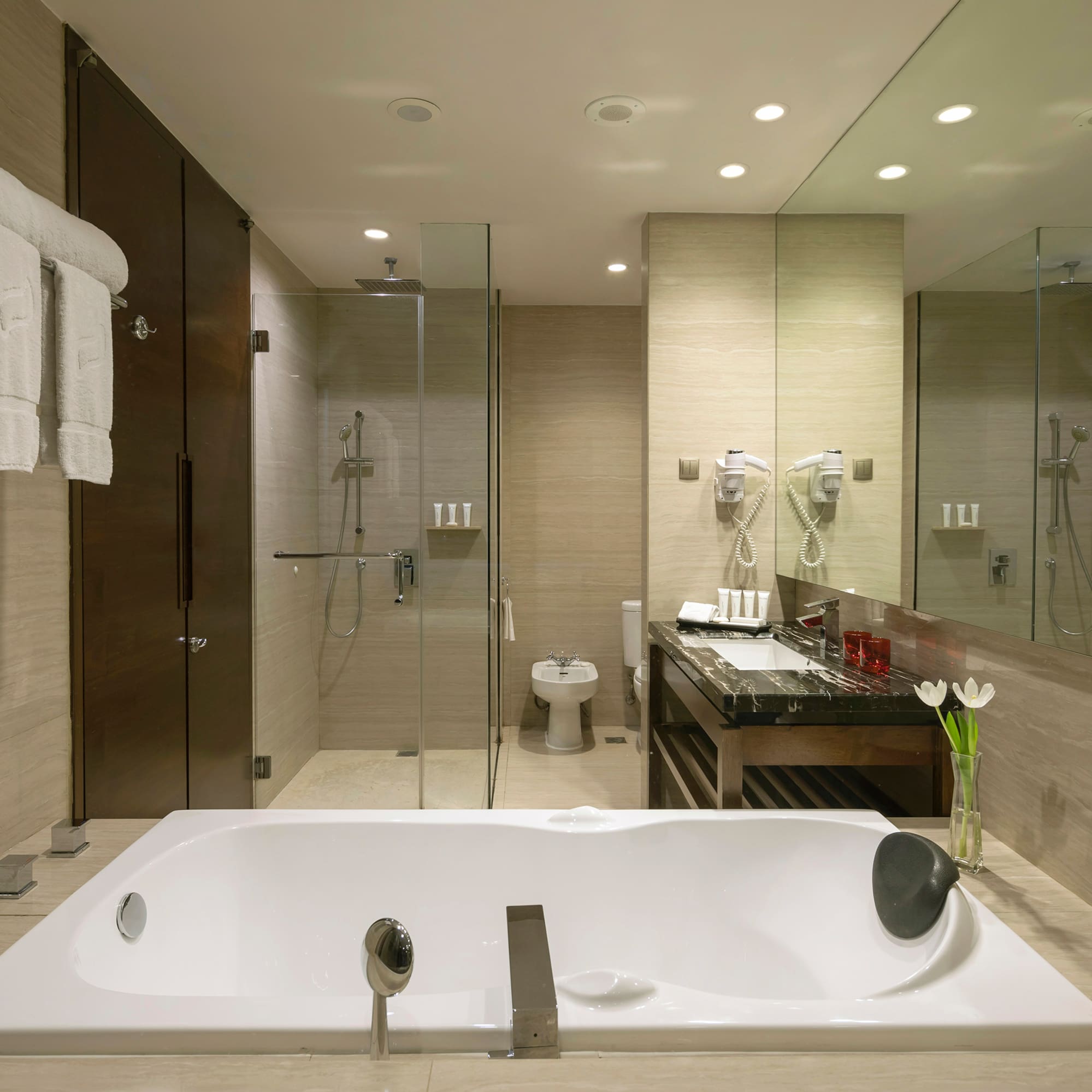 a bathroom with a bathtub and shower