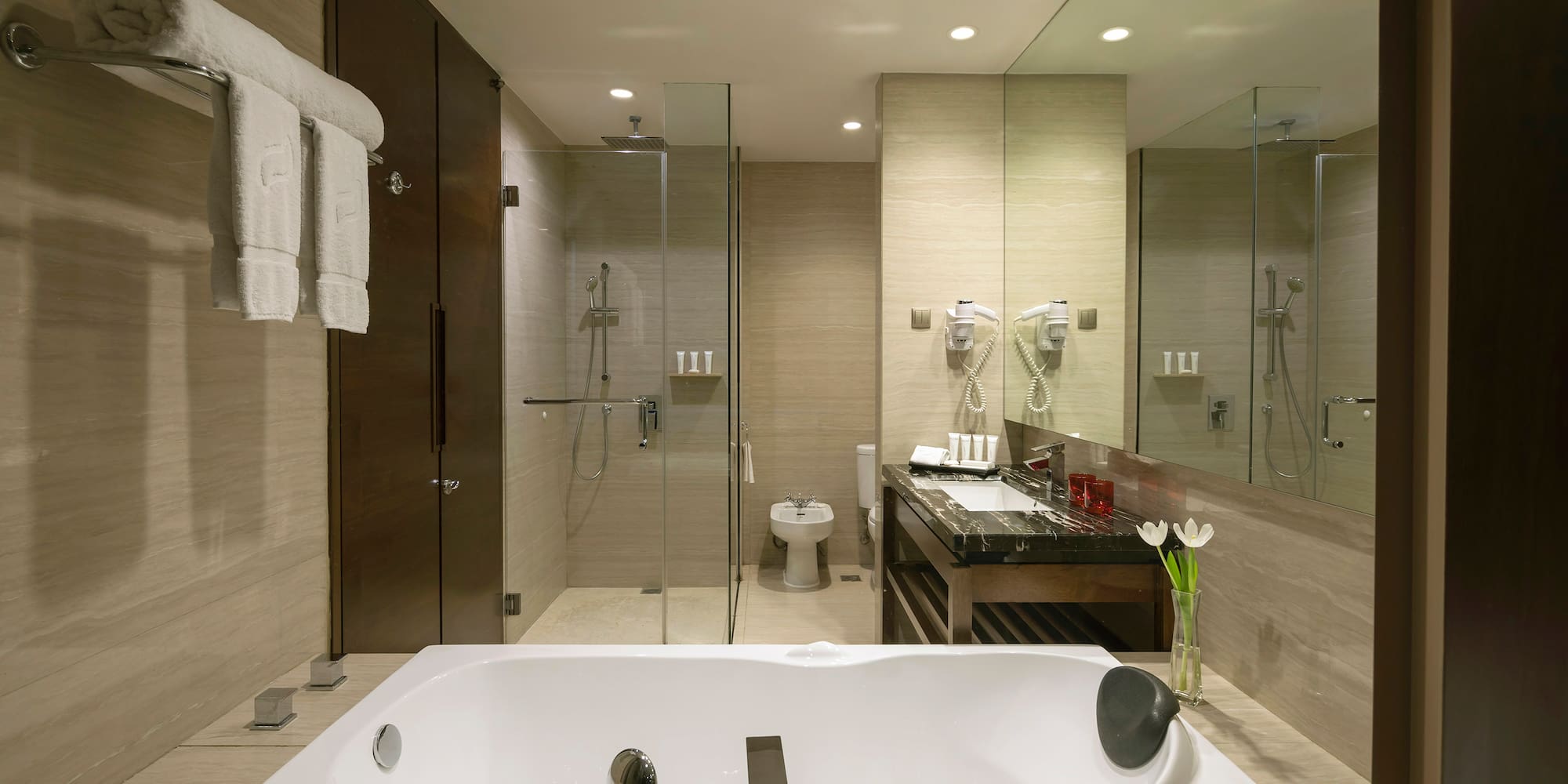 a bathroom with a bathtub and shower