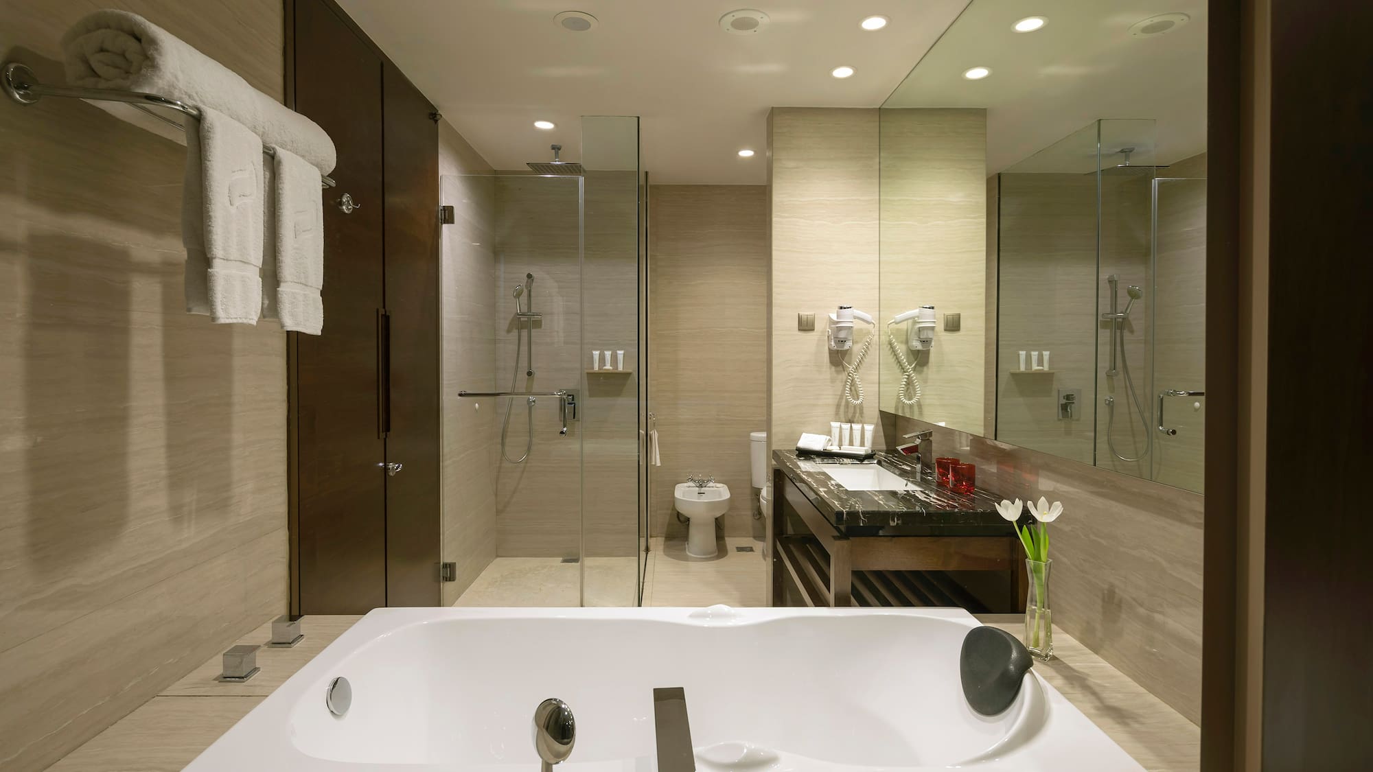 a bathroom with a bathtub and shower