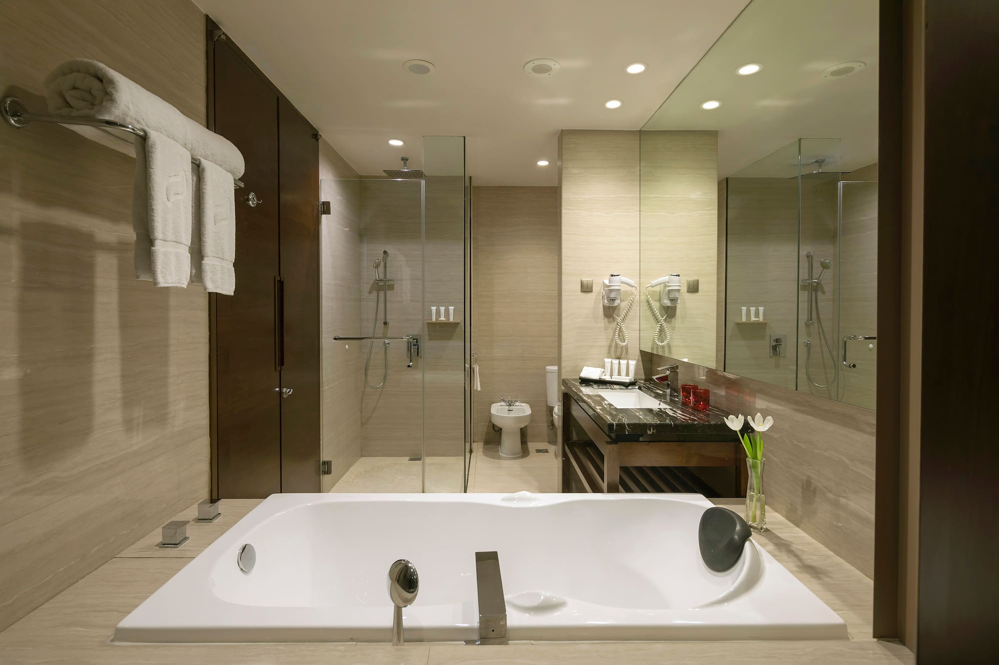a bathroom with a bathtub and shower