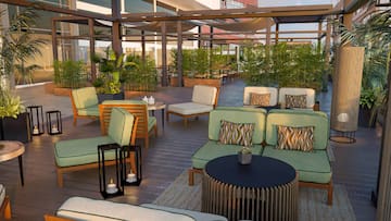 a patio area with chairs and tables