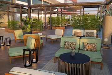 a patio area with chairs and tables