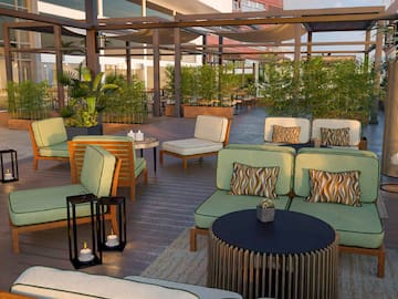 a patio area with chairs and tables