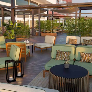 a patio area with chairs and tables