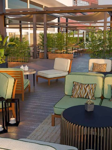 a patio area with chairs and tables