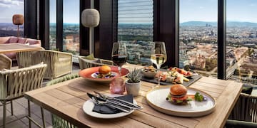 a table with food and wine glasses on it